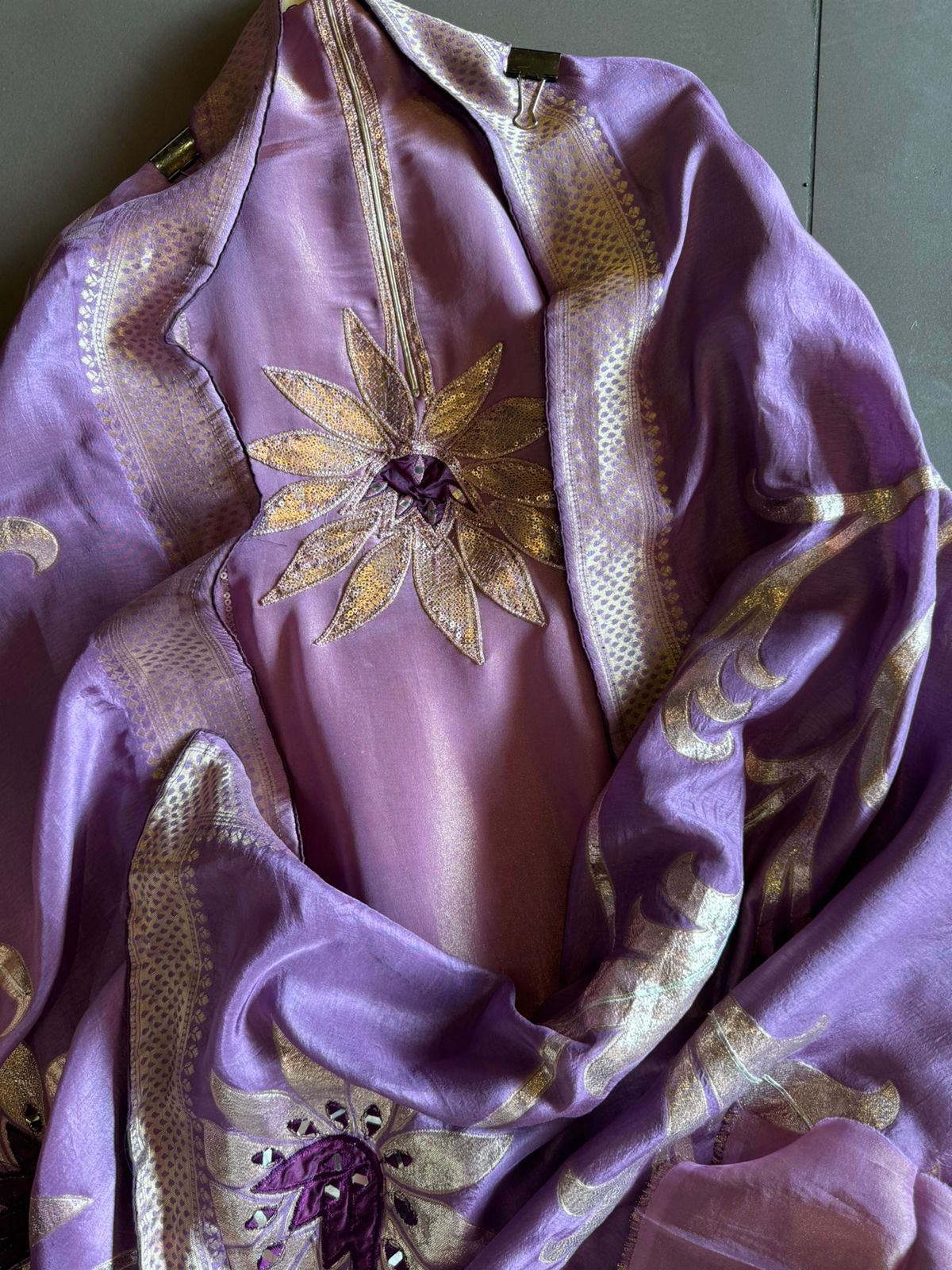 Pure Shimmer Tissue Unstitched Shirt with designer neckline with gotta Detailimgs and A flower design on the neck front with sequence and thread work done.