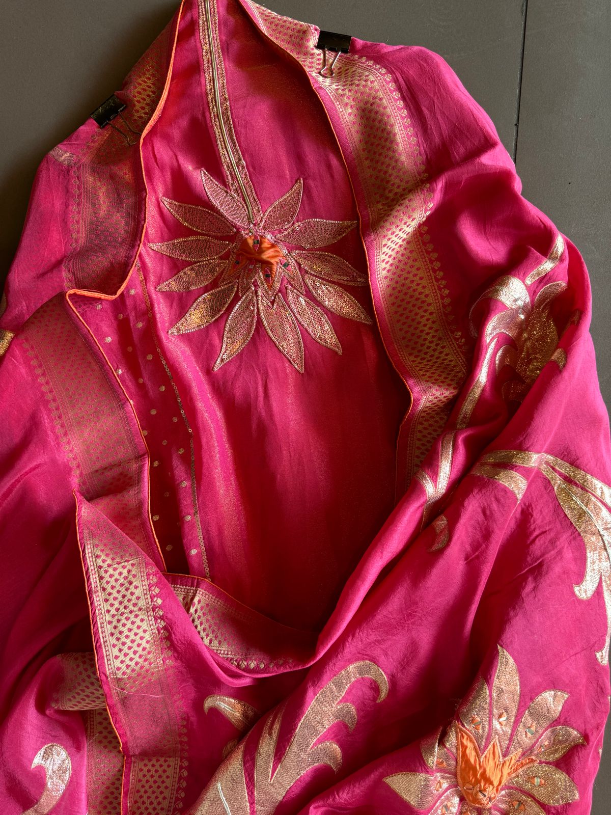 Pure Shimmer Tissue Unstitched Shirt with designer neckline with gotta Detailimgs and A flower design on the neck front with sequence and thread work done.