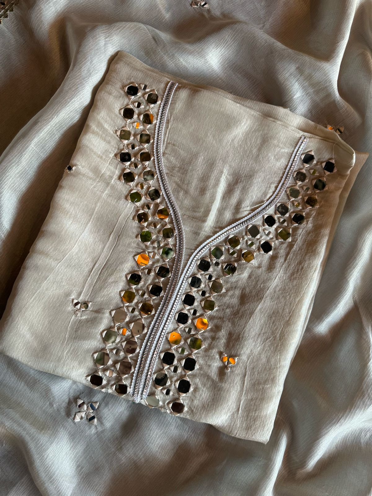 Shop our latest Mirror work tissue suits