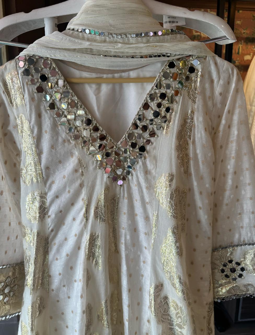 Presenting a very gorgeous stitched ivory full flared Anarkali suit