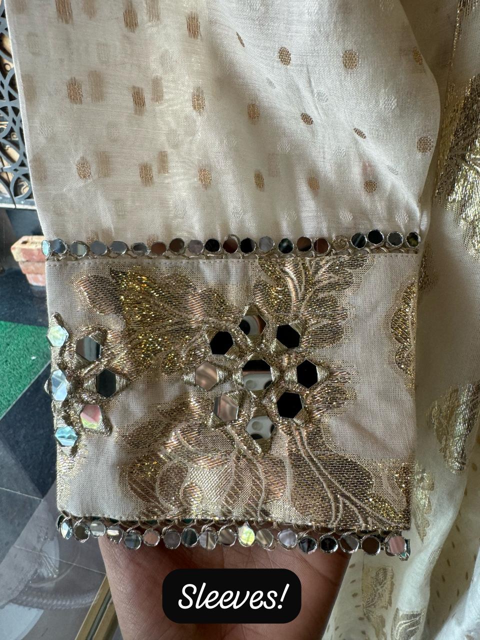 Presenting a very gorgeous stitched ivory full flared Anarkali suit