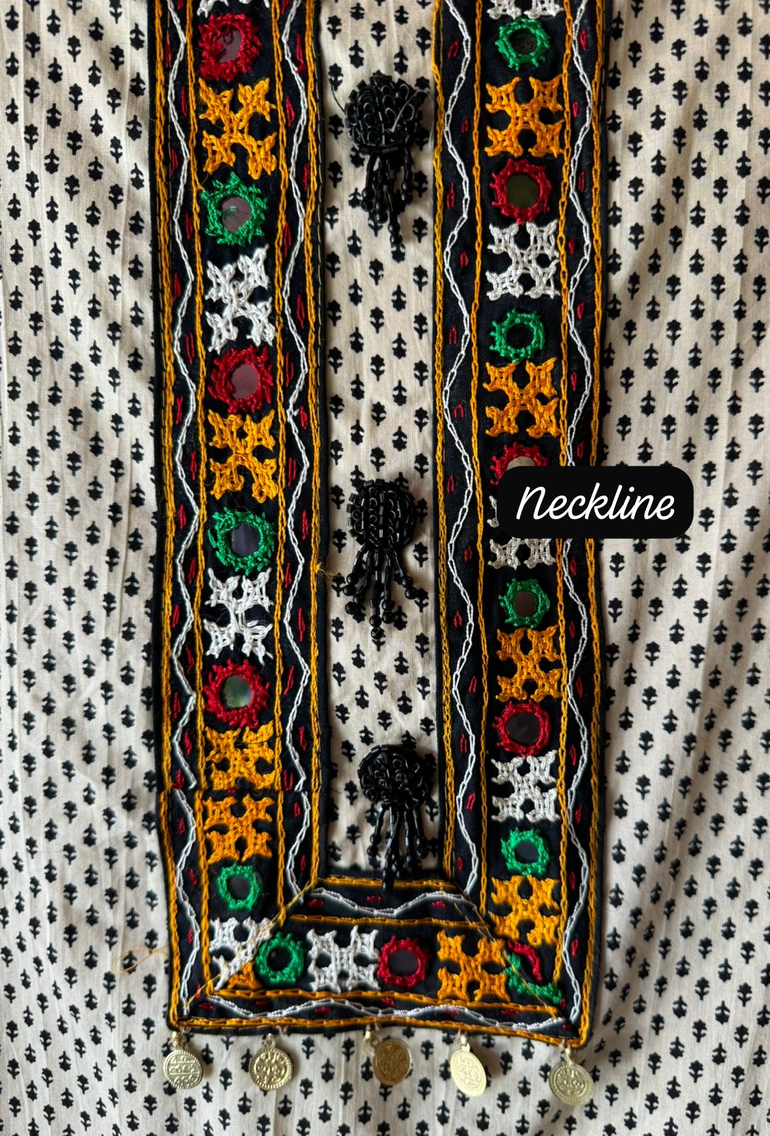 The fabric in the image is a traditional and vibrant unstitched dress