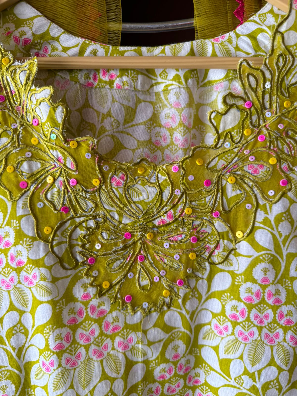 The outfit in the image appears to be made from a lightweight, breathable fabric