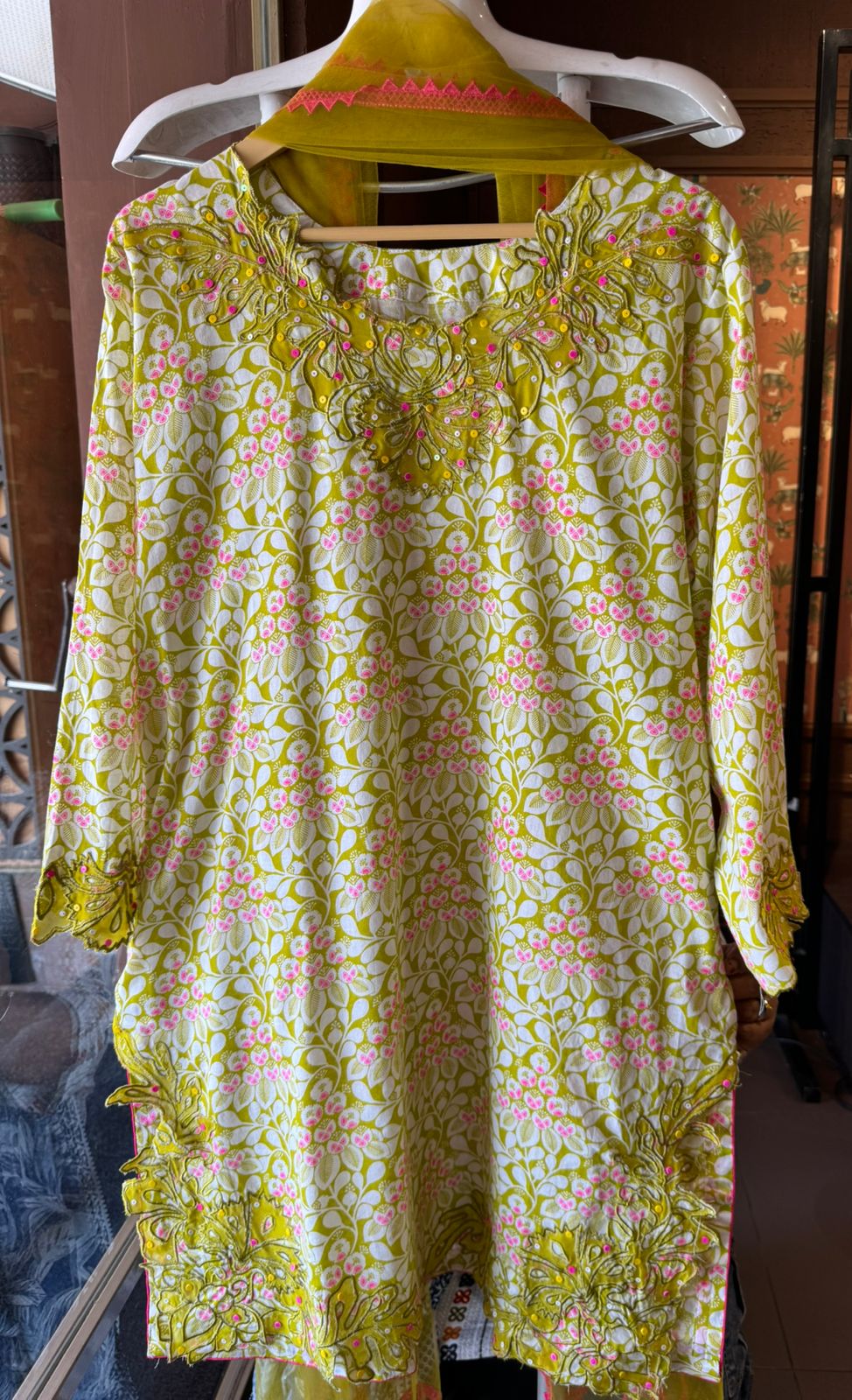 The outfit in the image appears to be made from a lightweight, breathable fabric