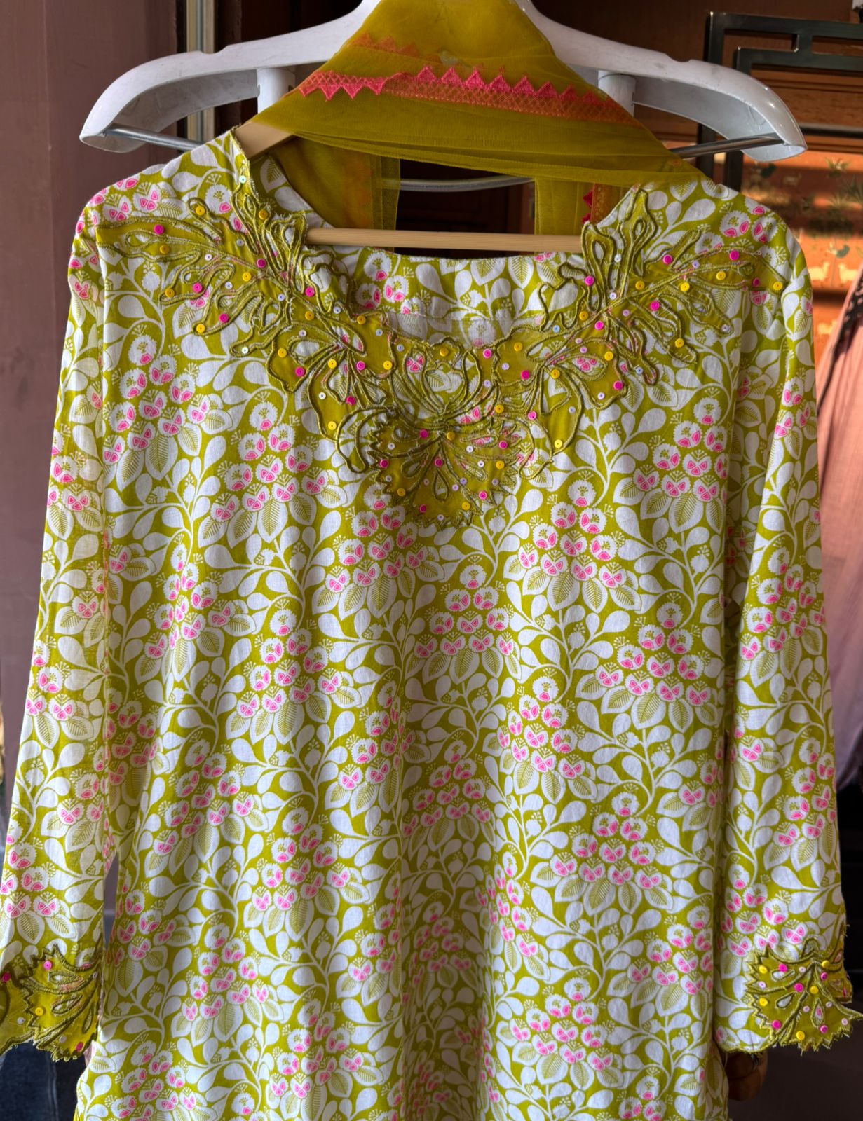 The outfit in the image appears to be made from a lightweight, breathable fabric