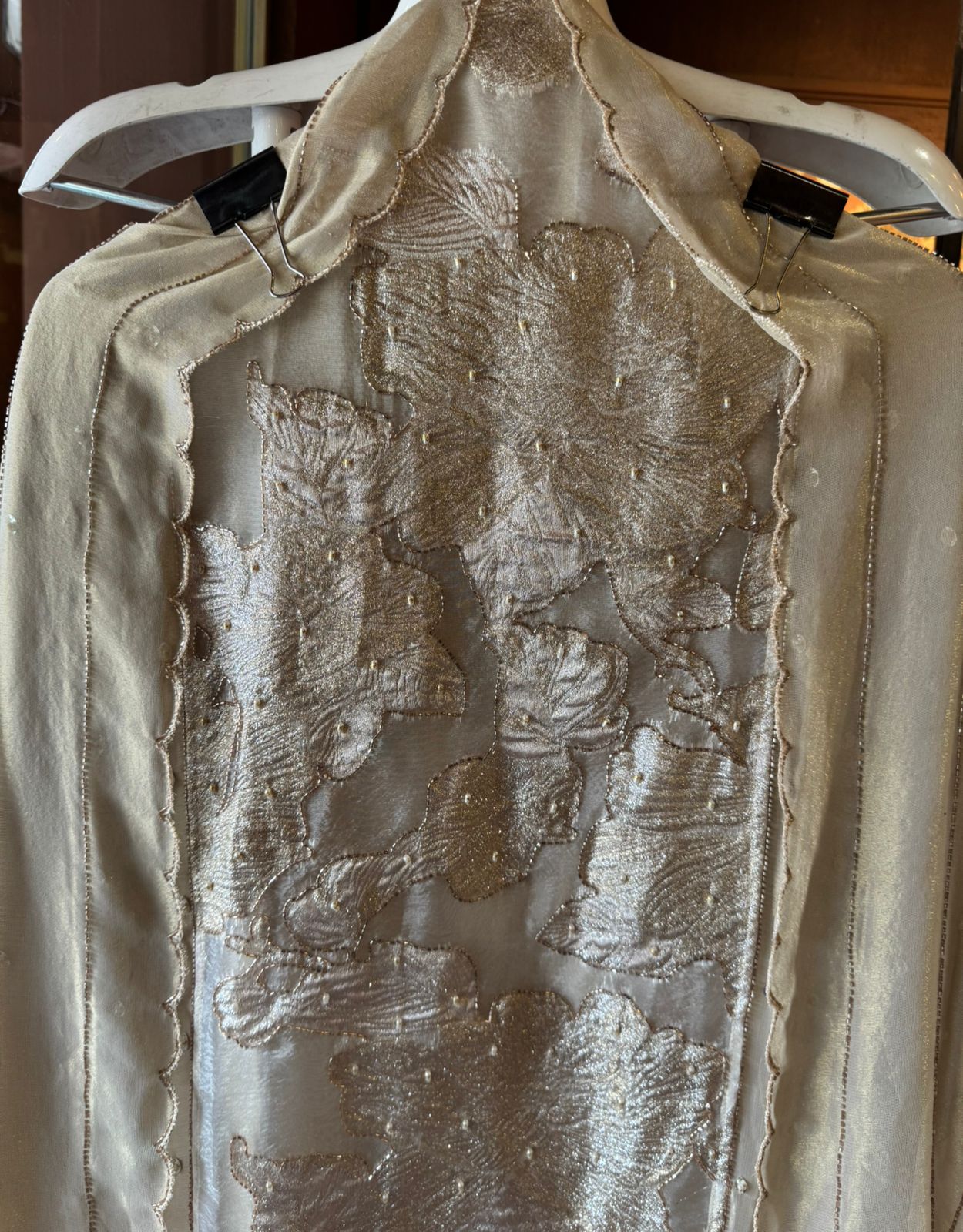 Presenting an elegant and heavily embellished beige/ivory Suit