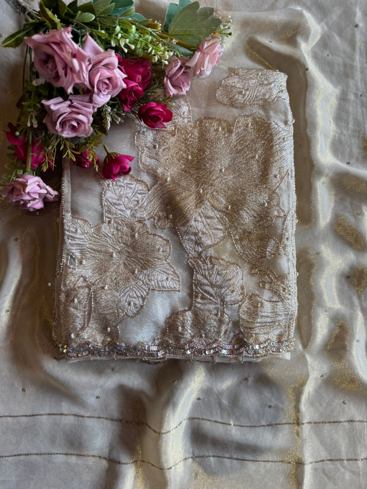 Presenting an elegant and heavily embellished beige/ivory Suit