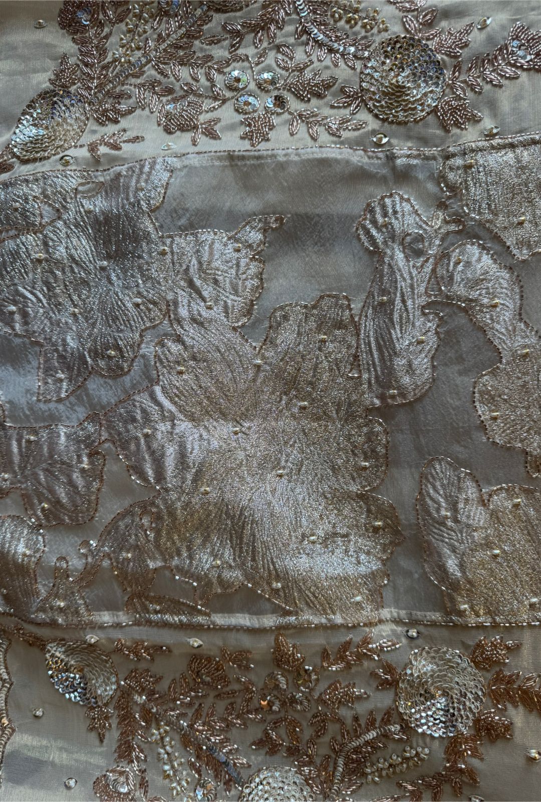 Presenting an elegant and heavily embellished beige/ivory Suit