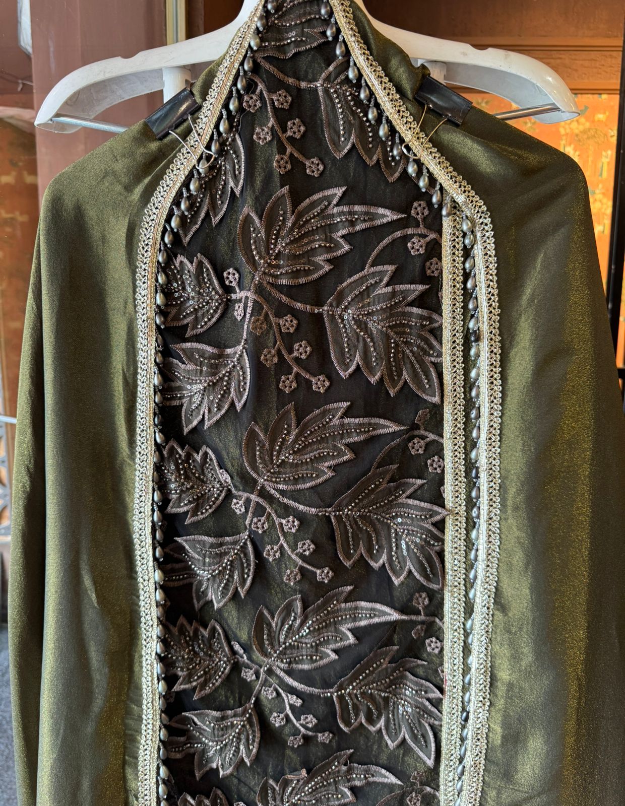 mesh/net fabric heavily embroidered with leaf and small floral motifs