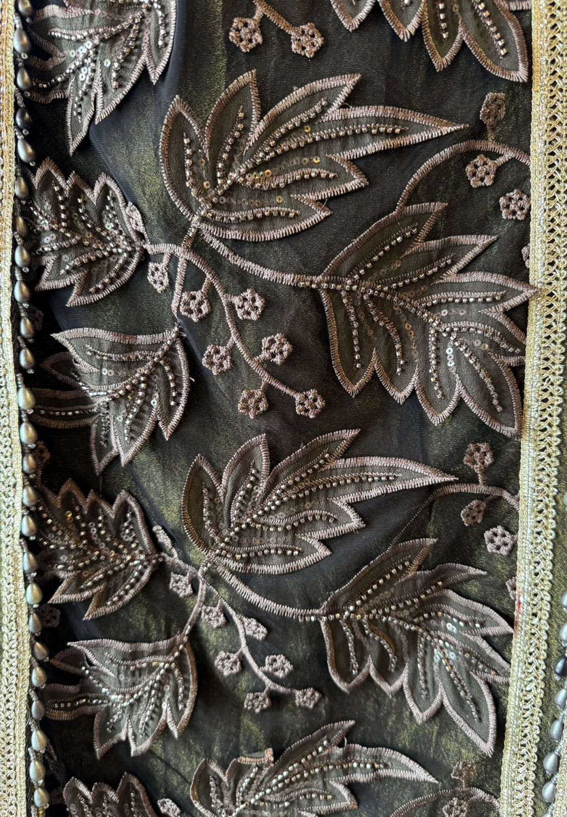 mesh/net fabric heavily embroidered with leaf and small floral motifs