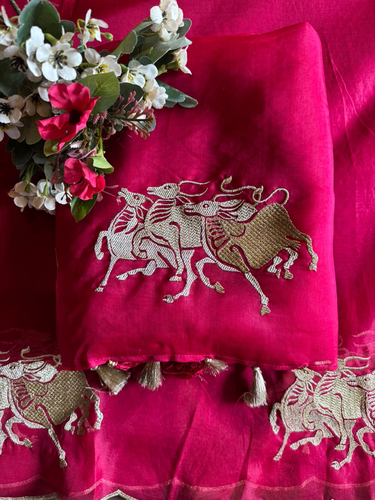 Dancing horse motifs, executed in golden zari