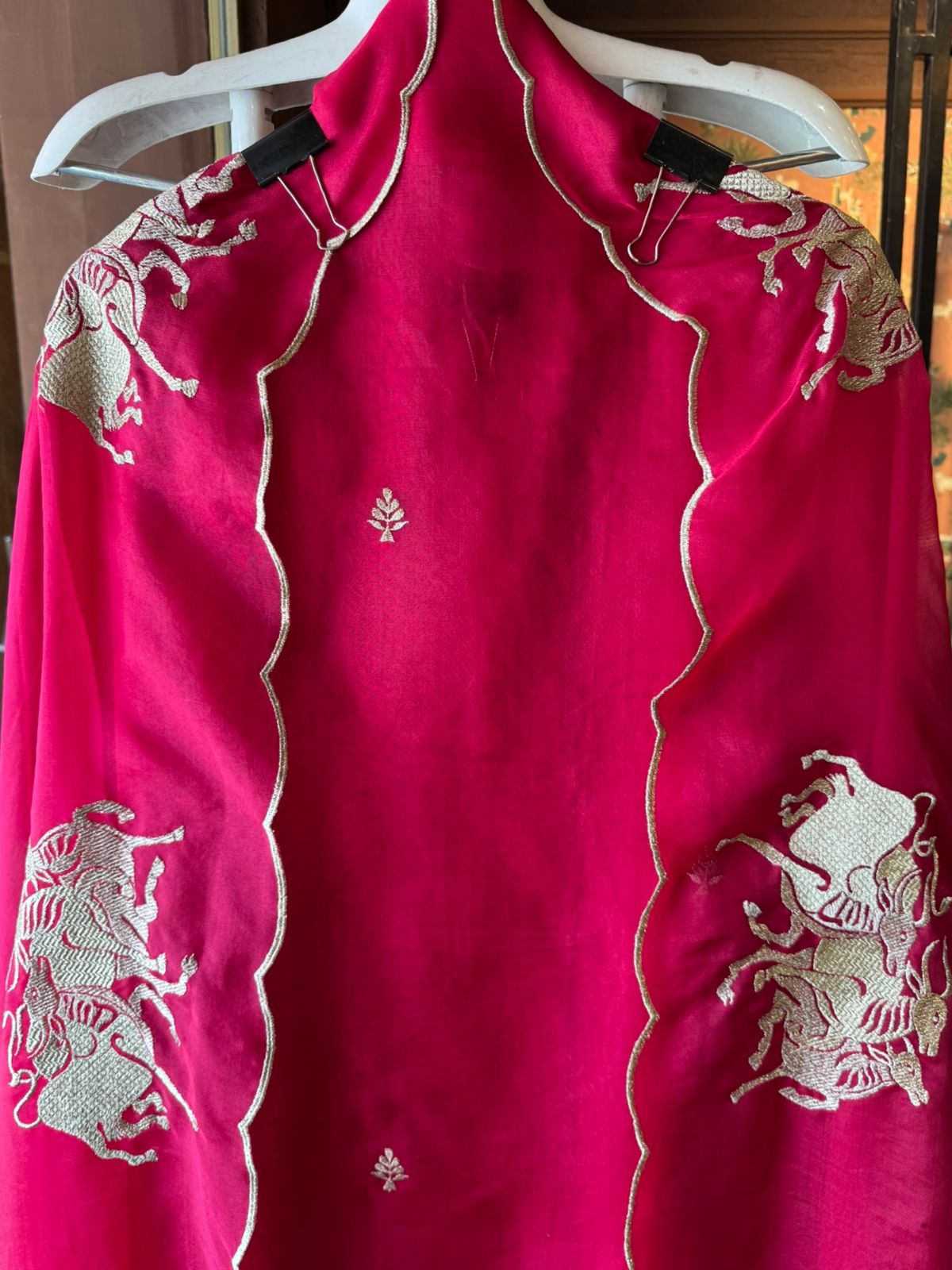 Dancing horse motifs, executed in golden zari