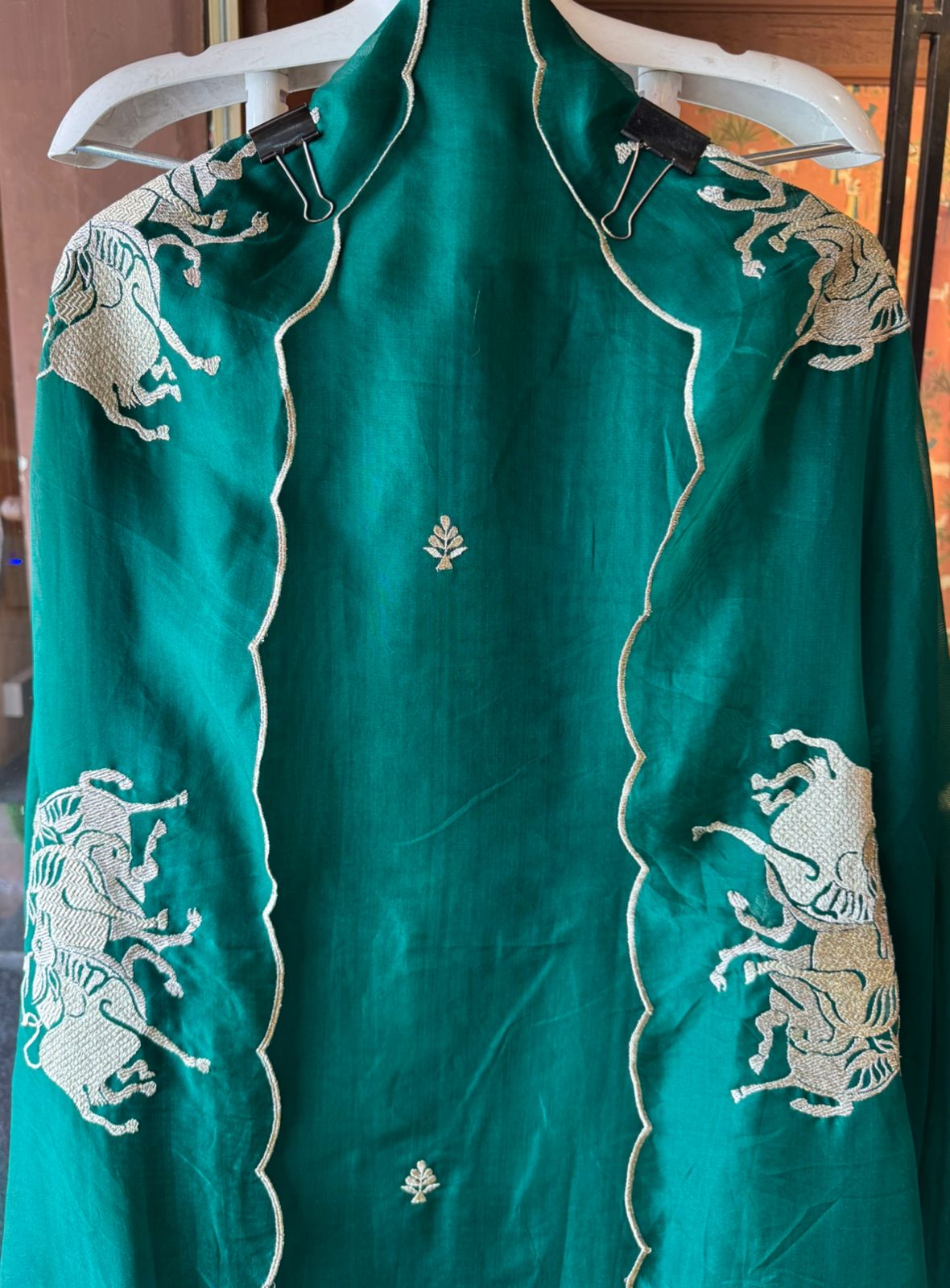 Dancing horse motifs, executed in golden zari