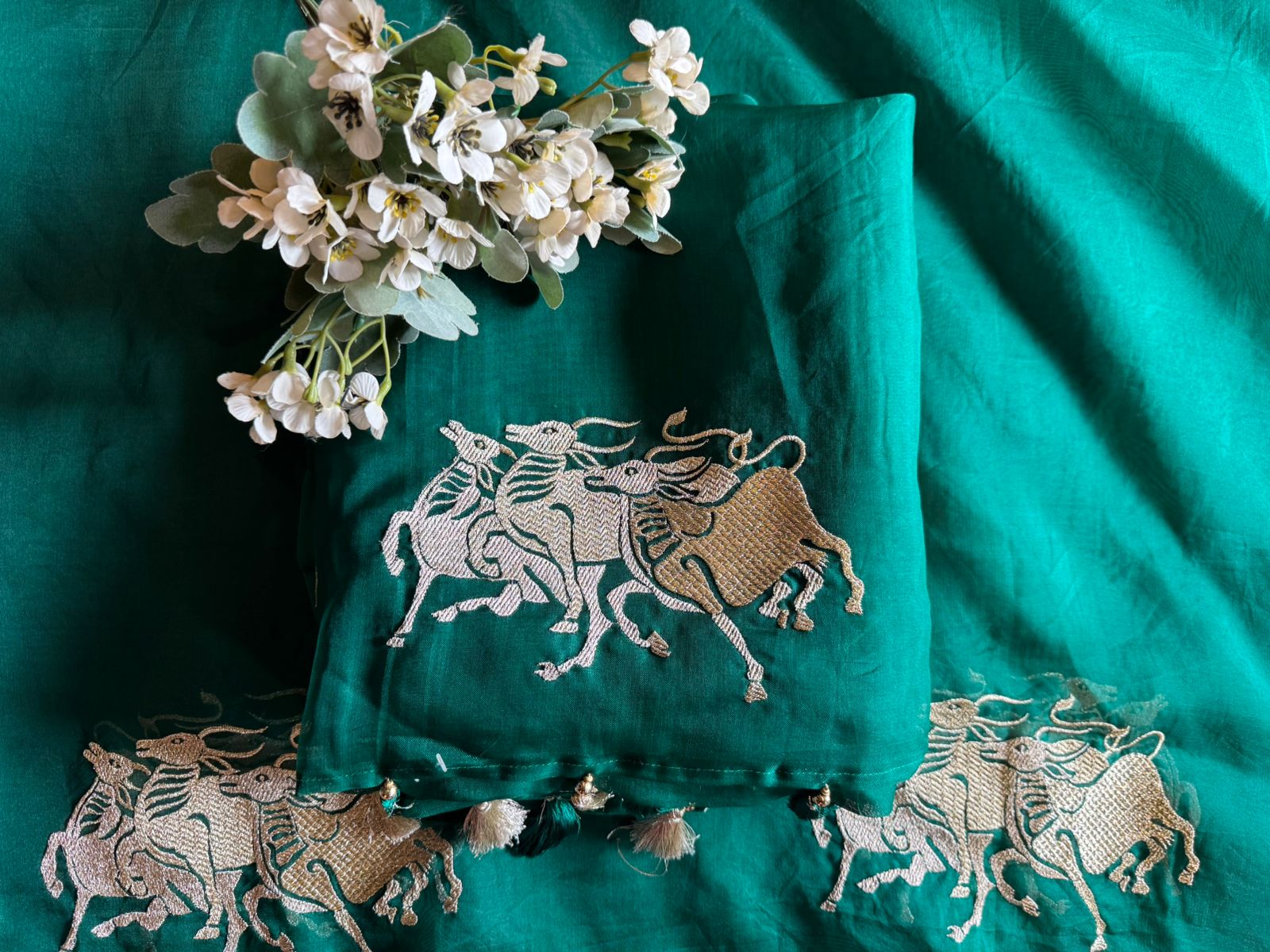 Dancing horse motifs, executed in golden zari