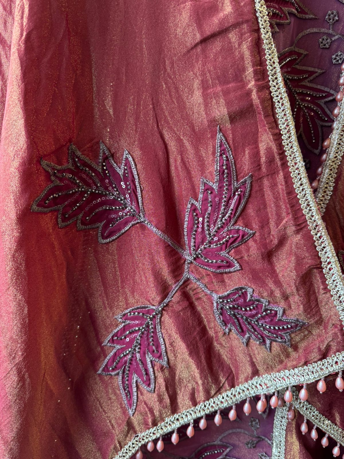 mesh/net fabric heavily embroidered with leaf and small floral motifs