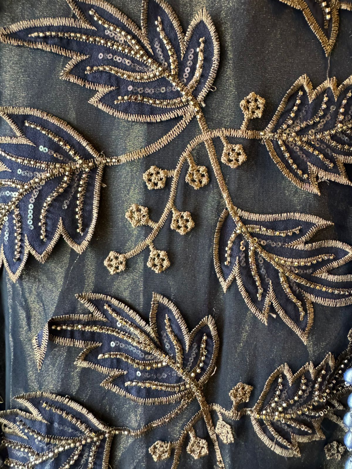 mesh/net fabric heavily embroidered with leaf and small floral motifs