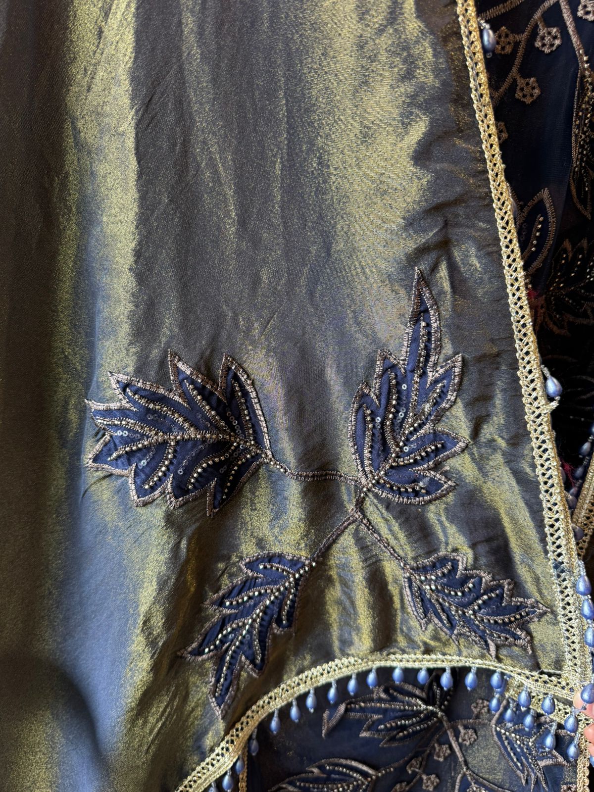 mesh/net fabric heavily embroidered with leaf and small floral motifs