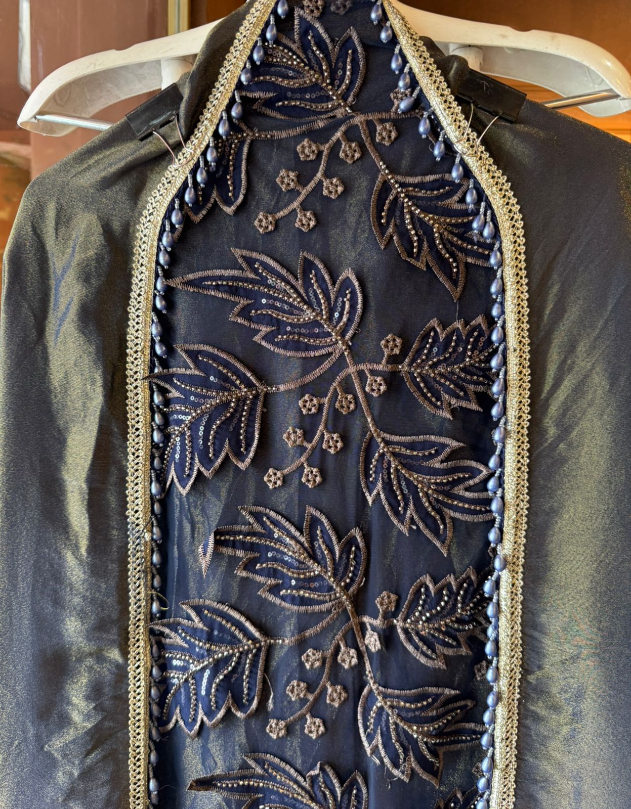 mesh/net fabric heavily embroidered with leaf and small floral motifs