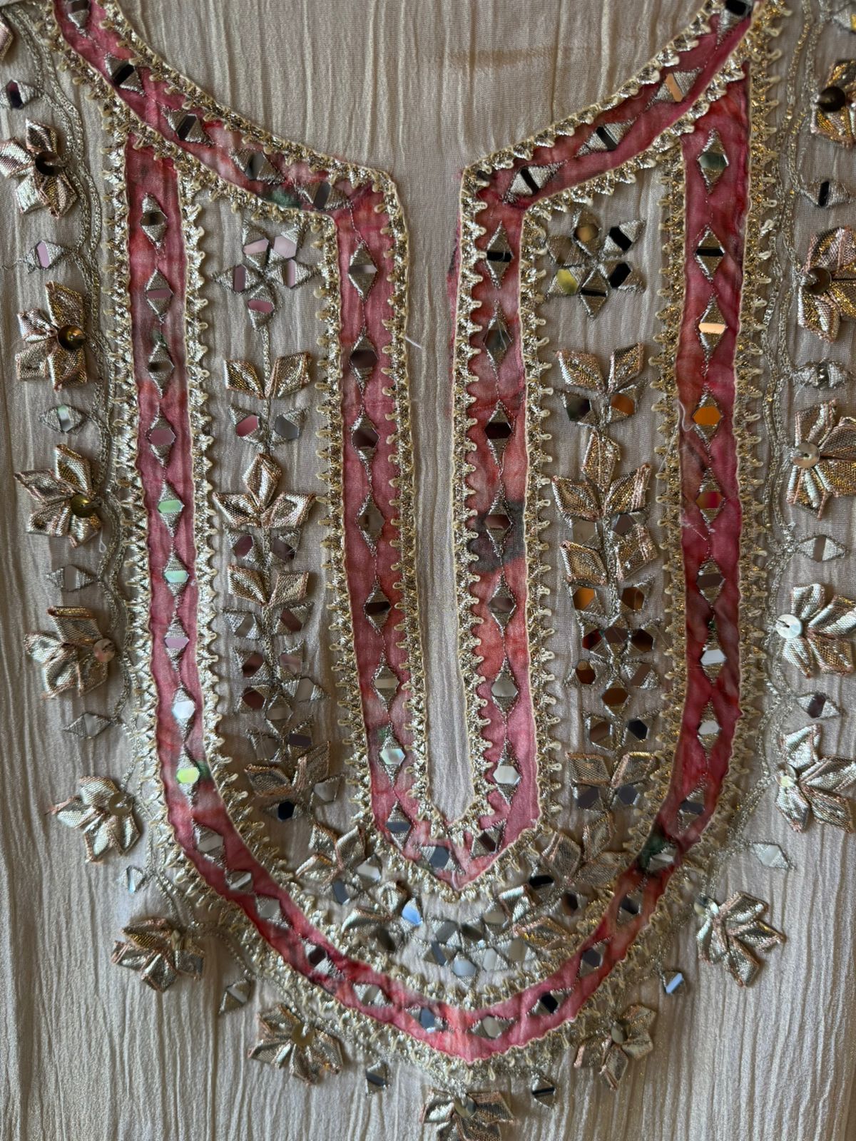 Traditional mirror work combined with delicate embroidery