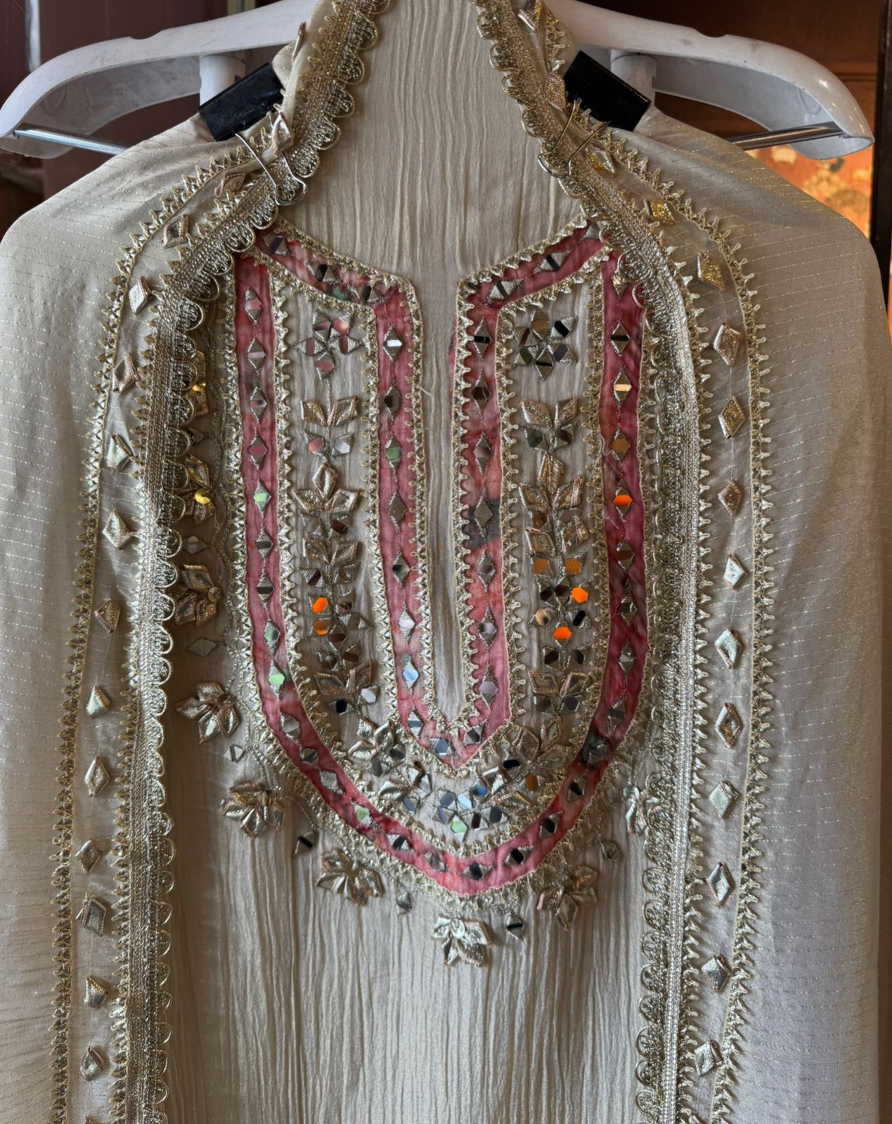 Traditional mirror work combined with delicate embroidery