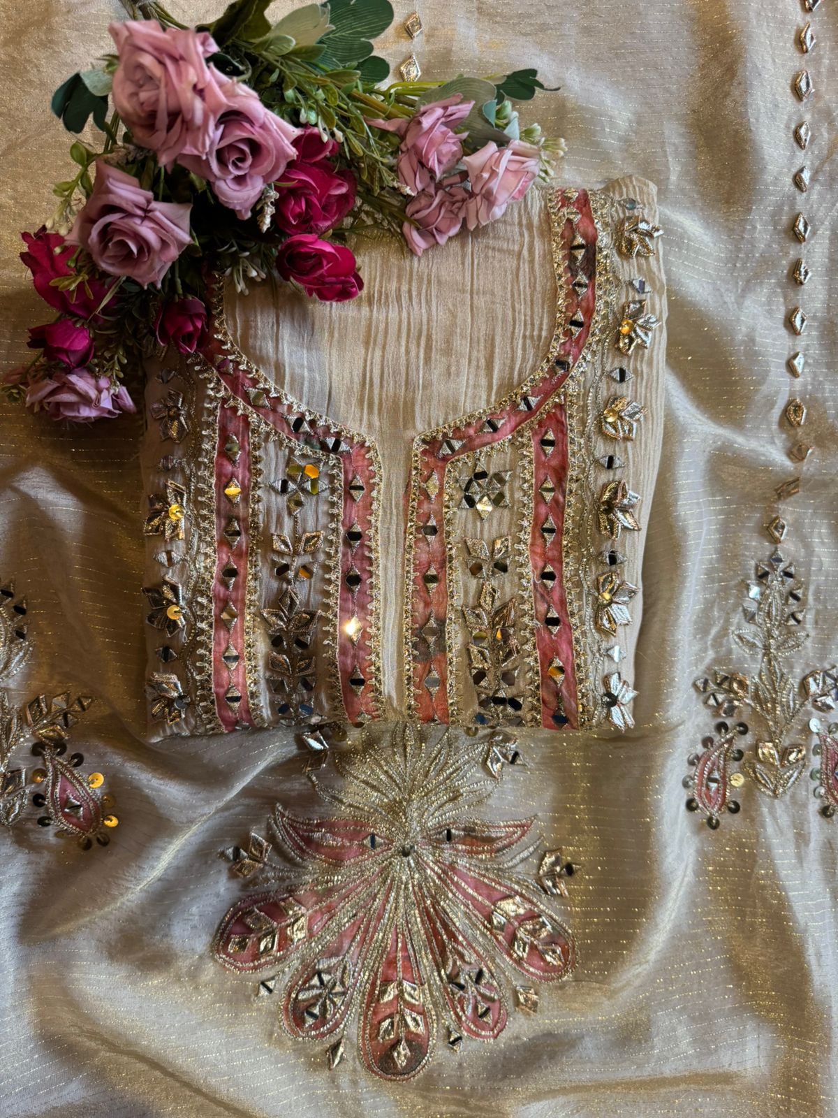 Traditional mirror work combined with delicate embroidery