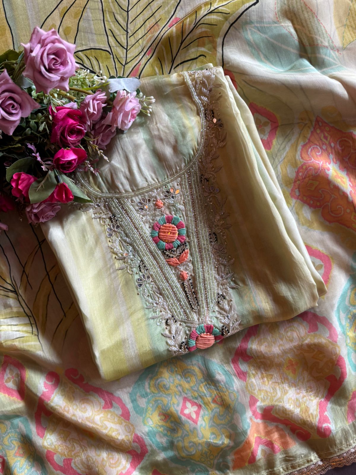 V-shape with heavy embroidered yoke