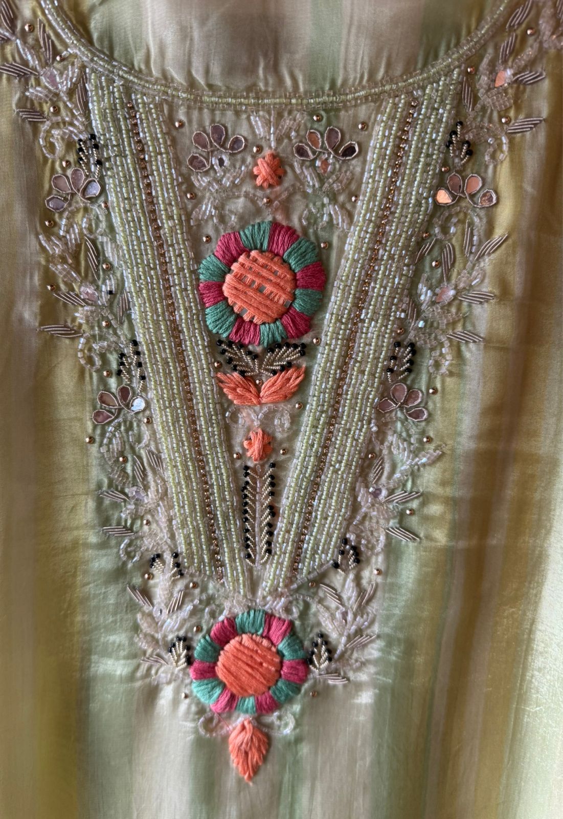 V-shape with heavy embroidered yoke