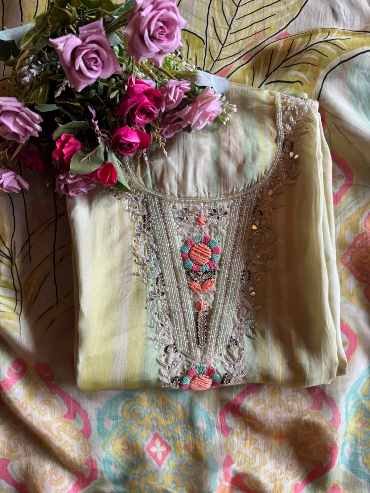 V-shape with heavy embroidered yoke