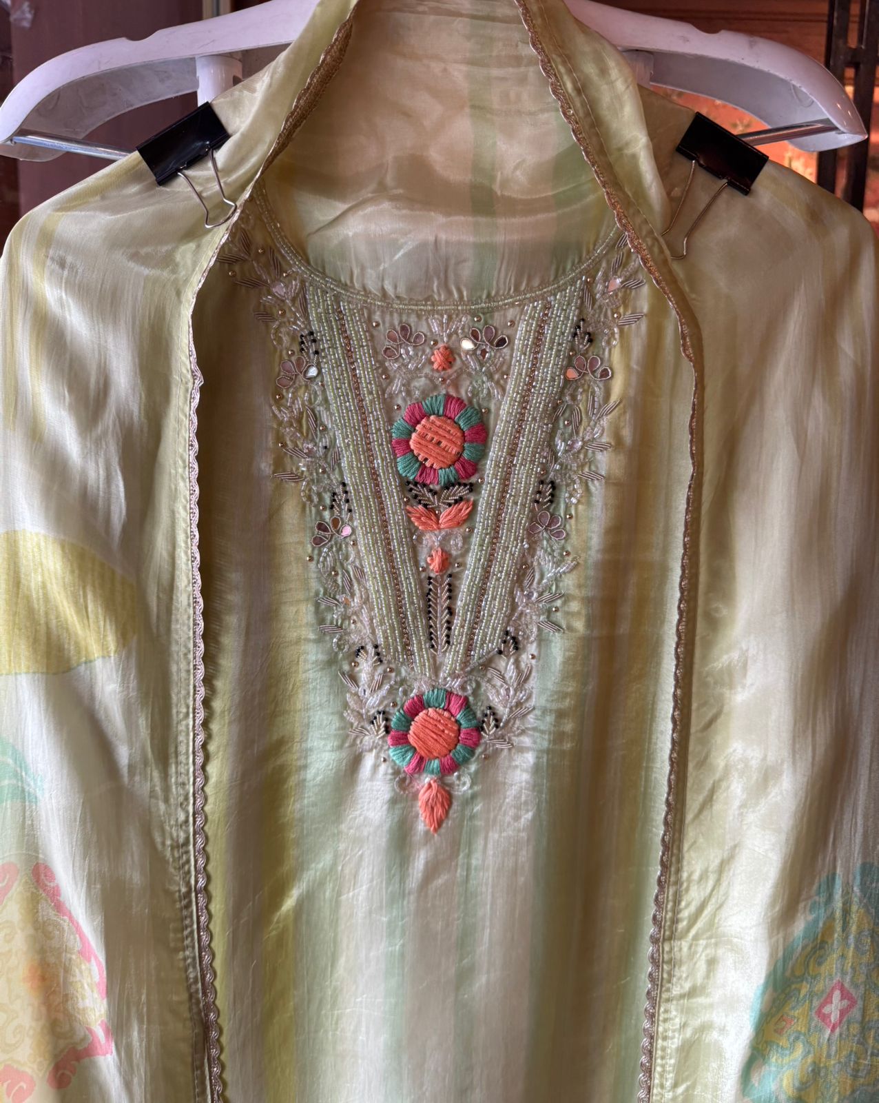 V-shape with heavy embroidered yoke