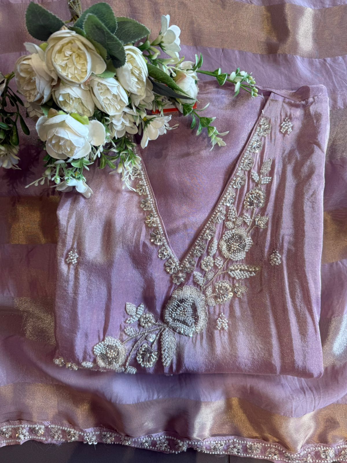 elegant suit set with intricate and delicate embroidery work