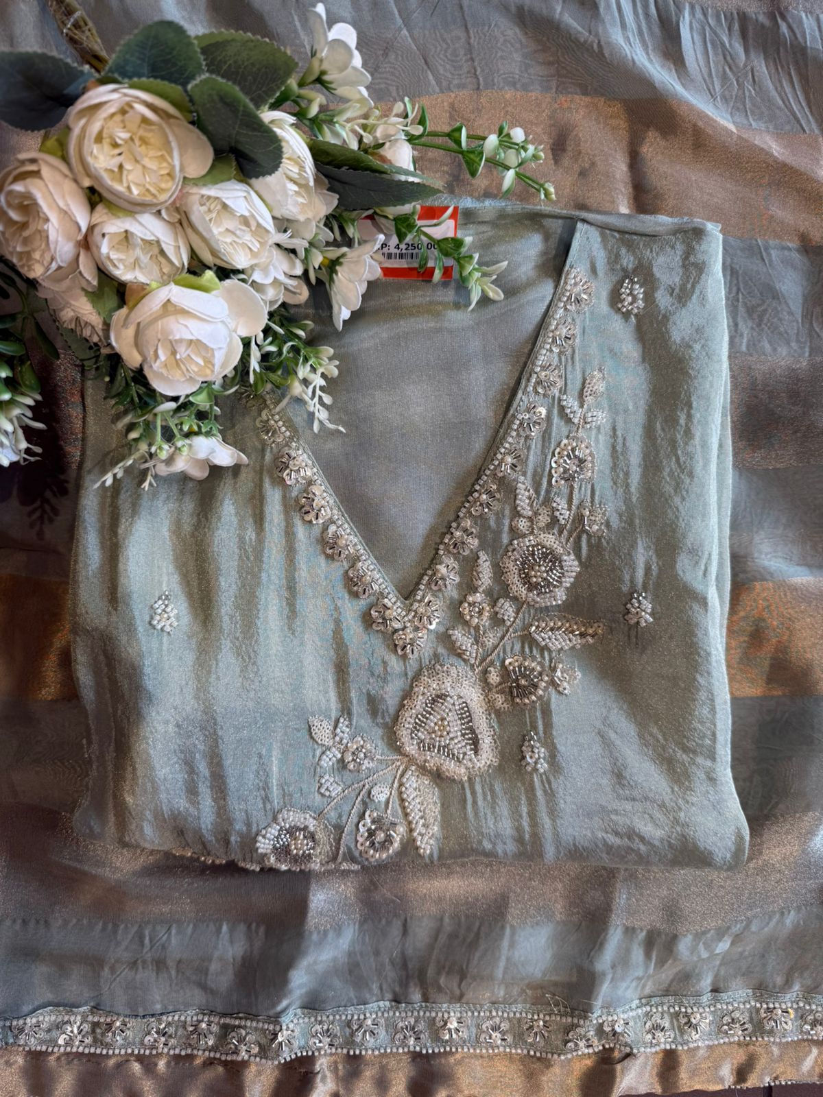 elegant suit set with intricate and delicate embroidery work