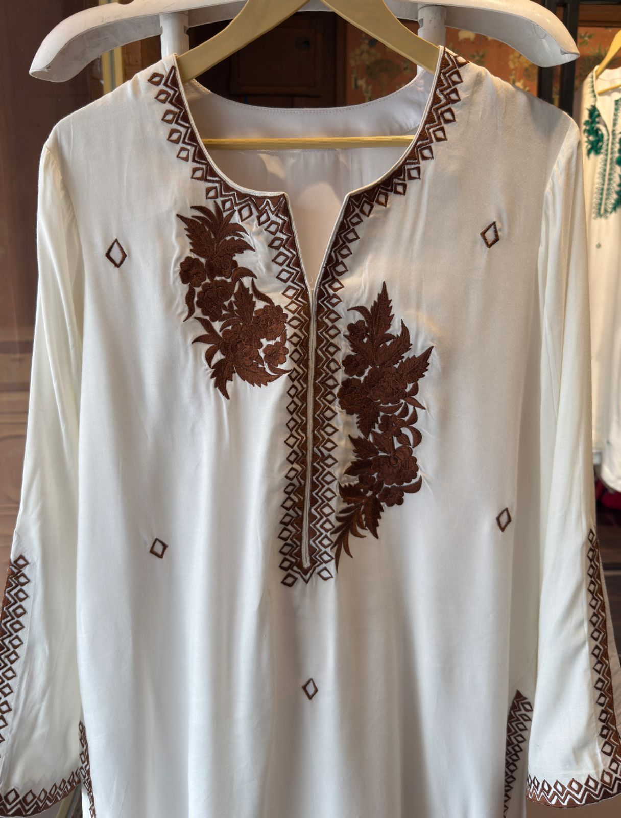 White-colored kurta featuring elegant embroidery