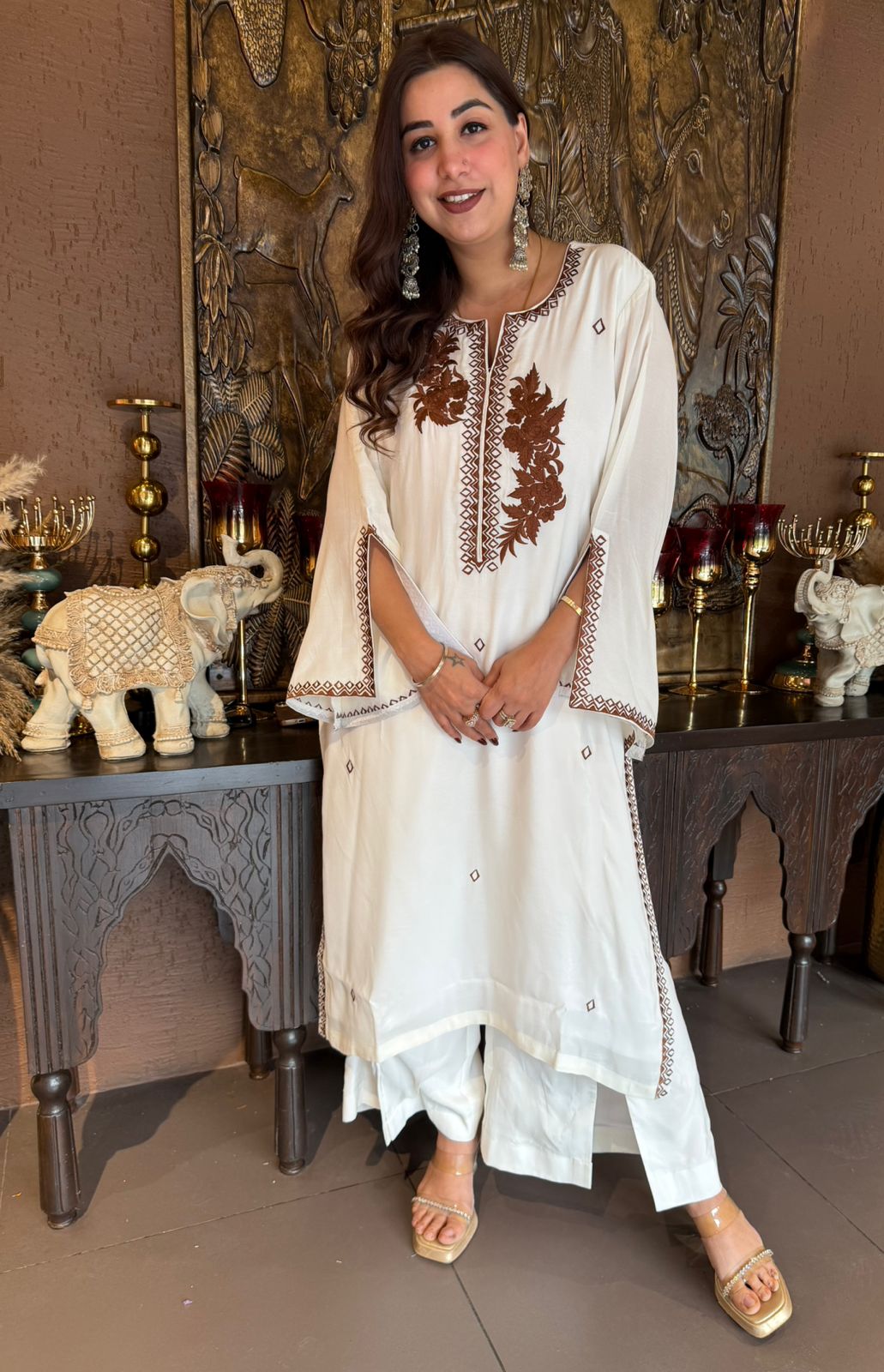 White-colored kurta featuring elegant embroidery