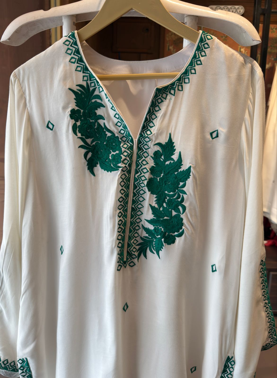White-colored kurta featuring elegant embroidery