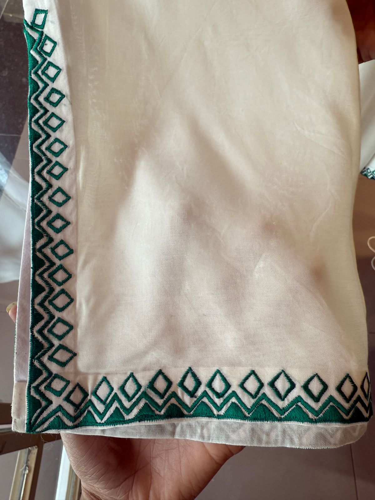 White-colored kurta featuring elegant embroidery
