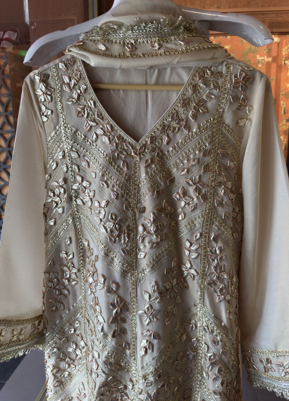 Elegant beige or off-white traditional suit