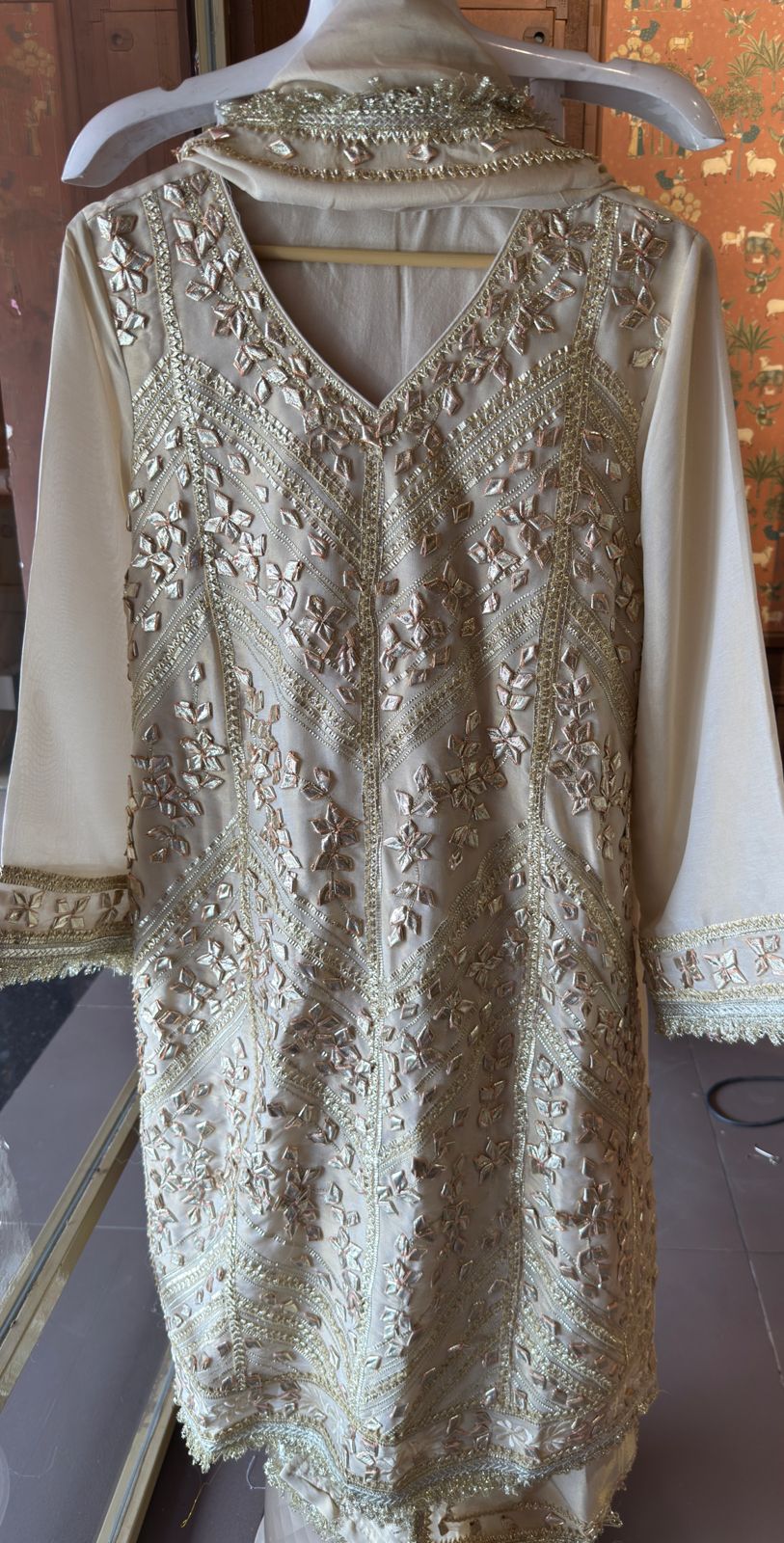 Elegant beige or off-white traditional suit