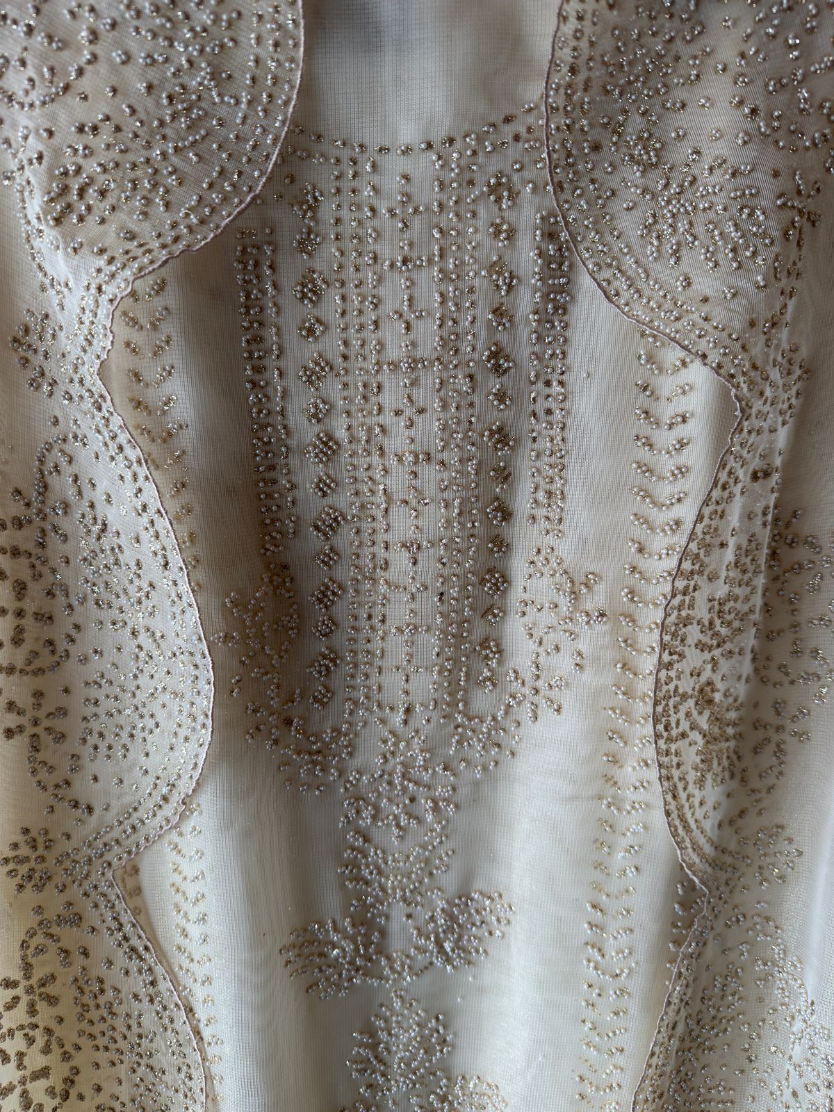 Off-white traditional ensemble