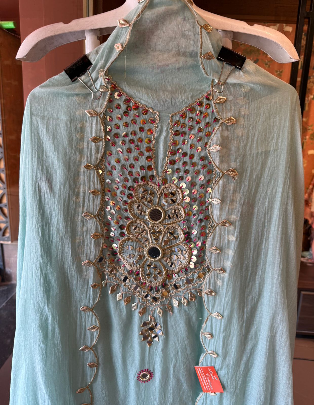 Heavily embellished traditional suit