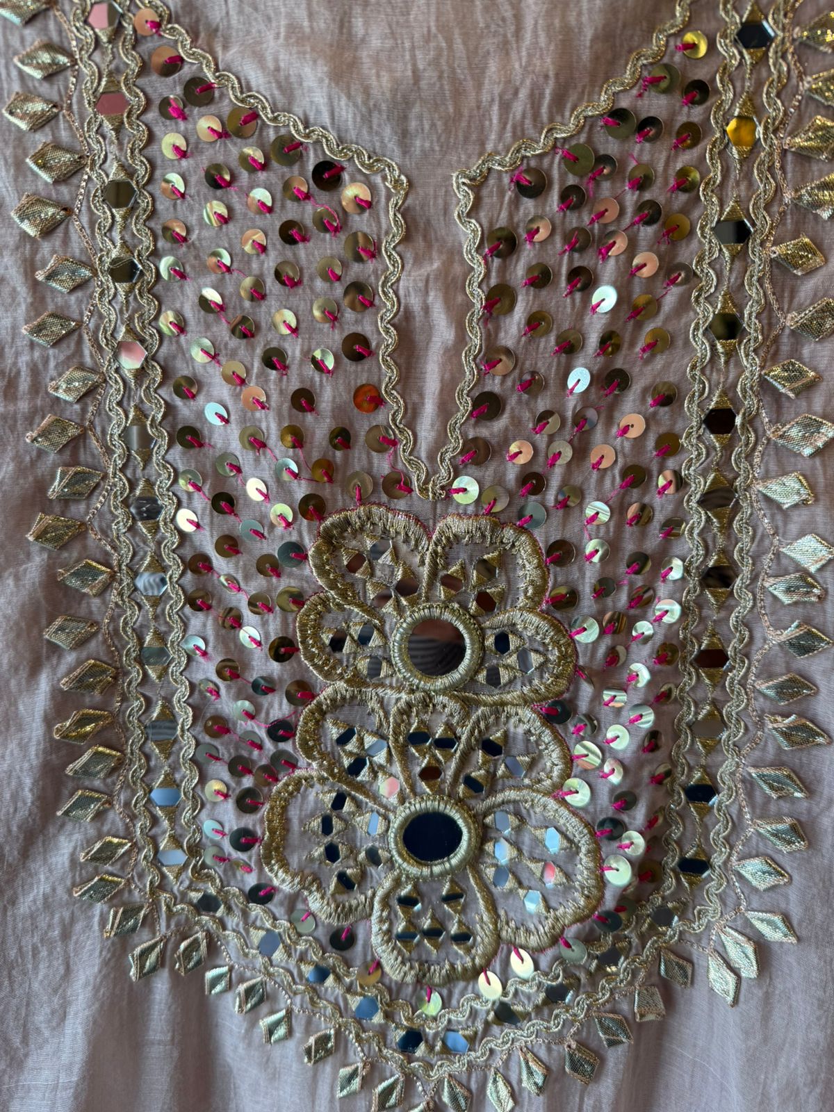 Heavily embellished traditional suit