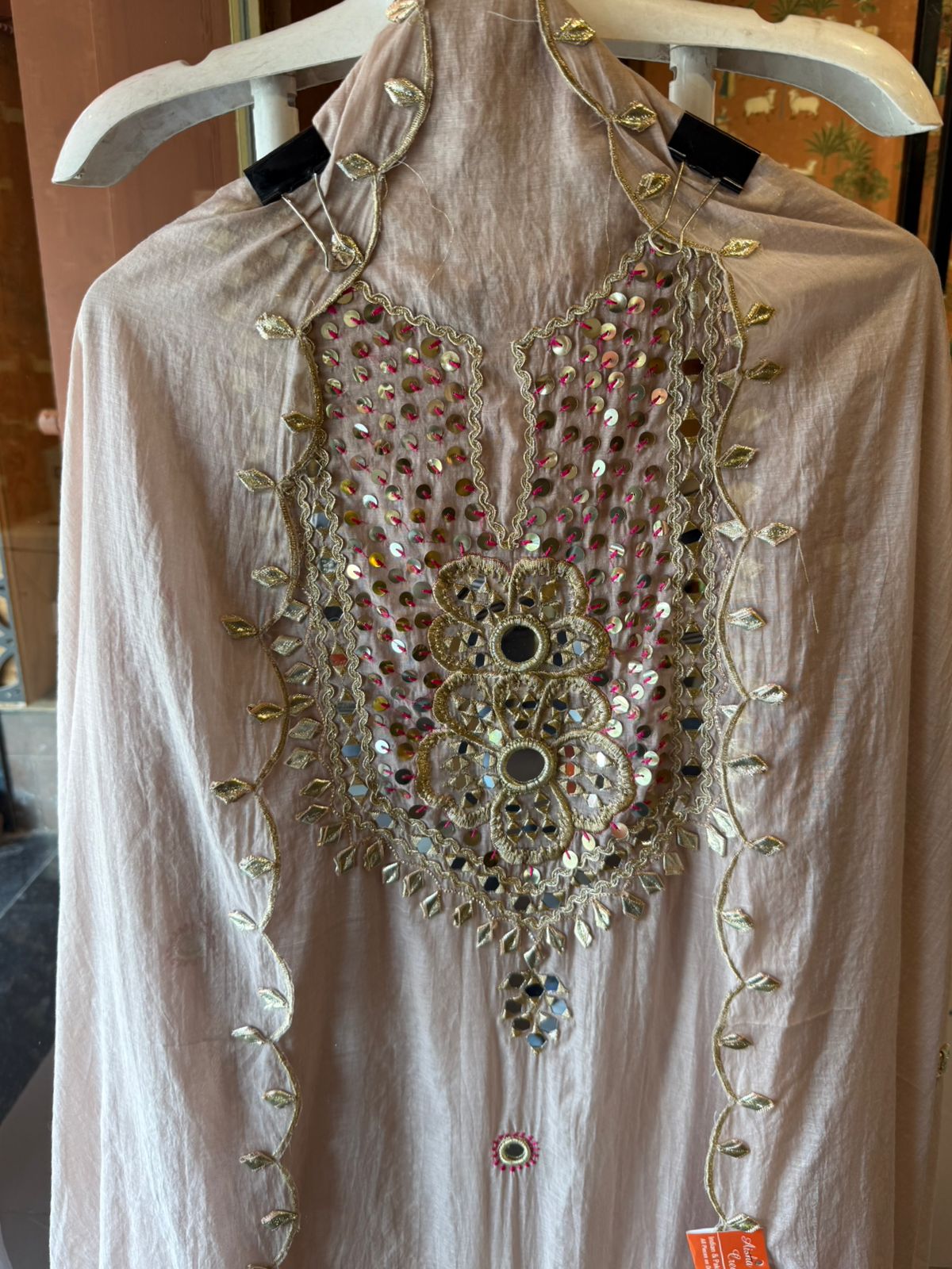 Heavily embellished traditional suit