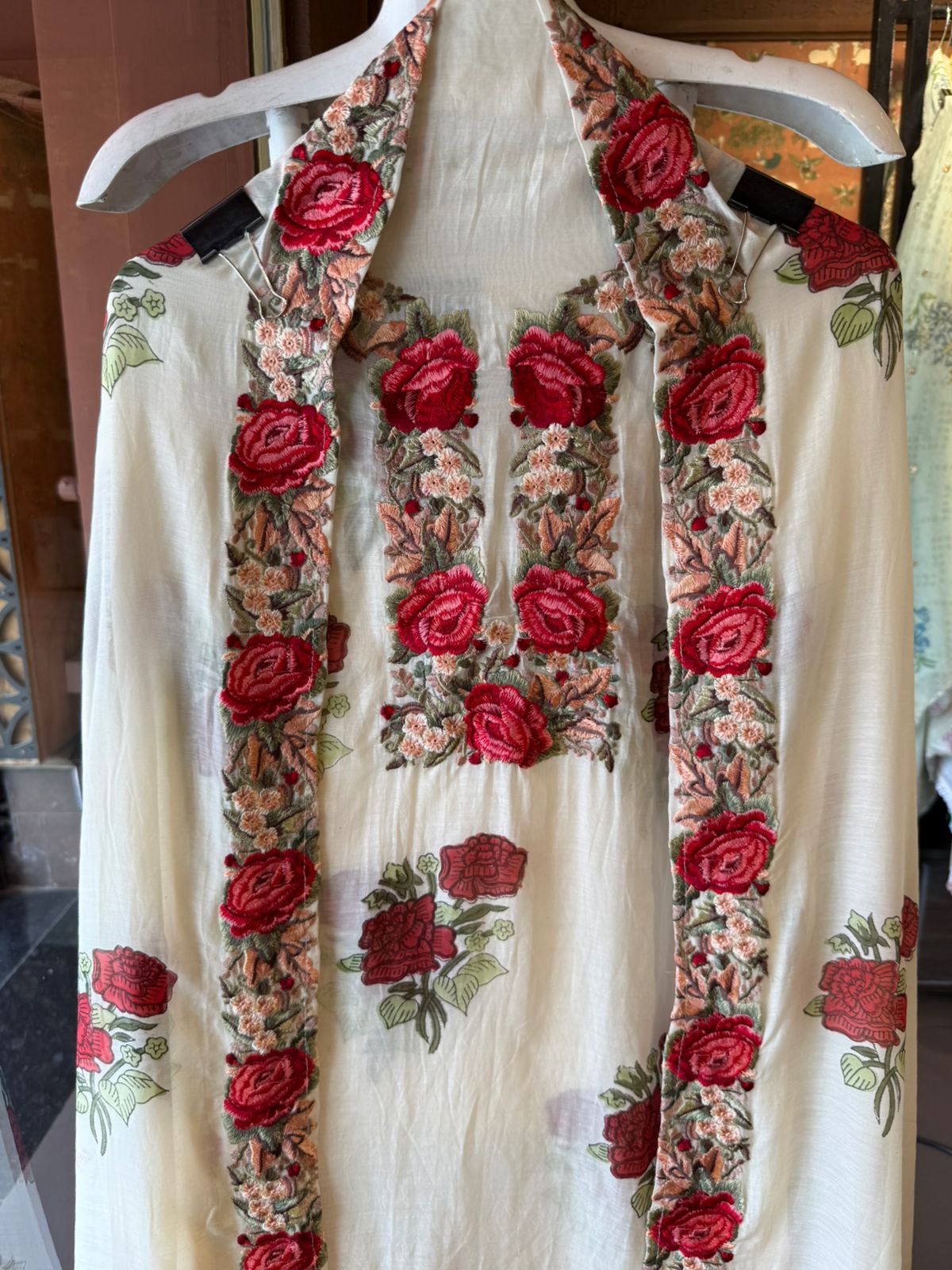 Elegant ensemble elevated with statement red rose embroidery