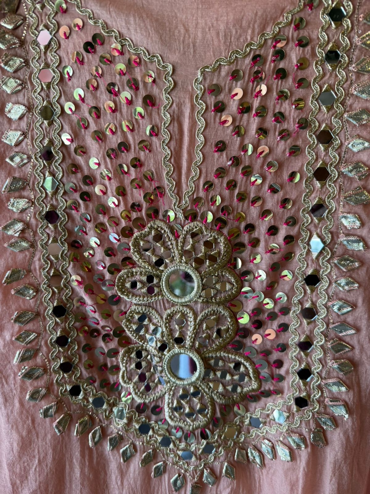 Heavily embellished traditional suit