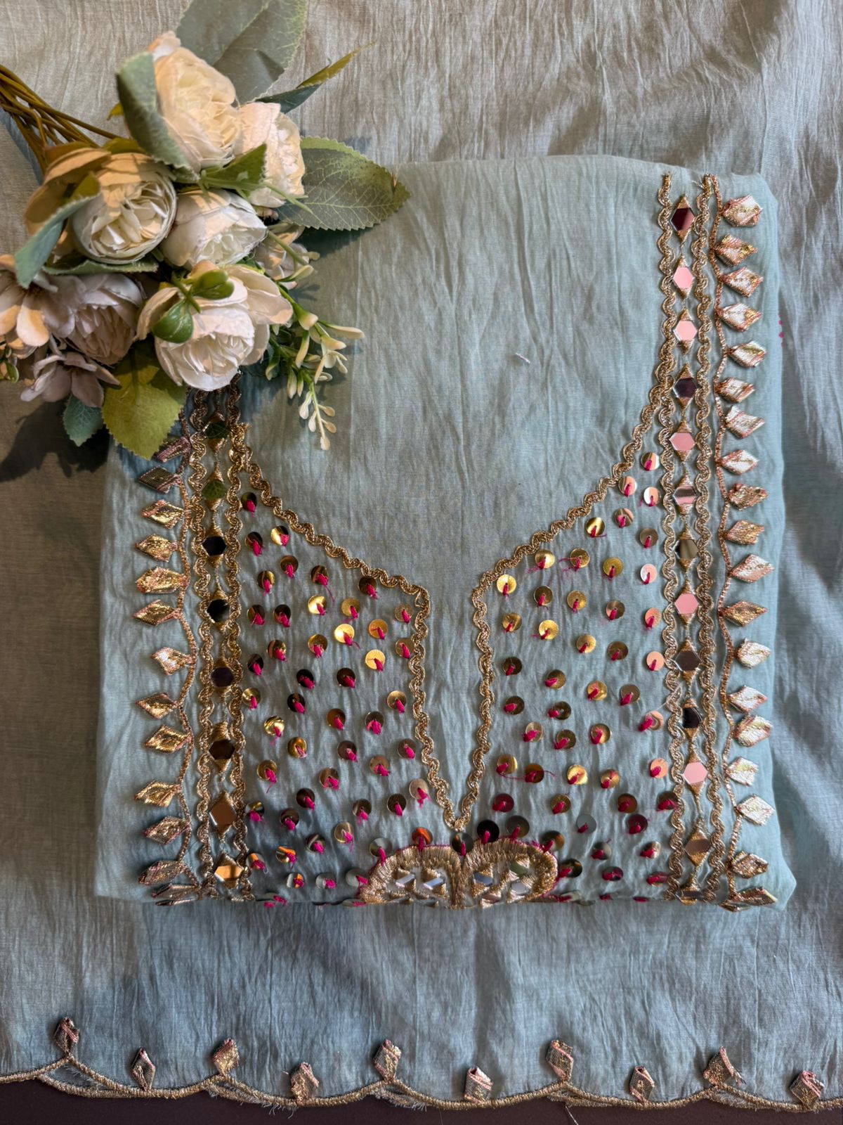 Heavily embellished traditional suit