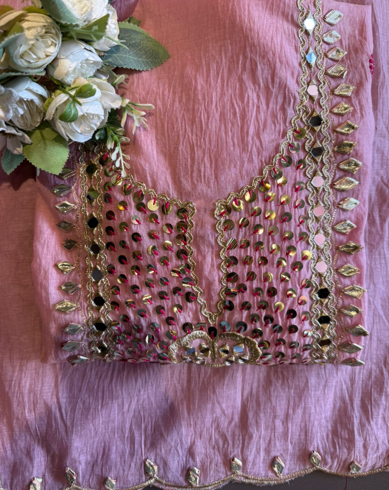 Heavily embellished traditional suit