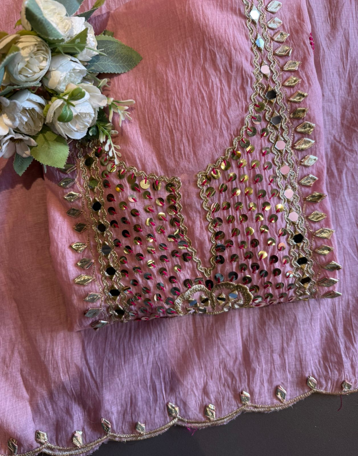 Heavily embellished traditional suit