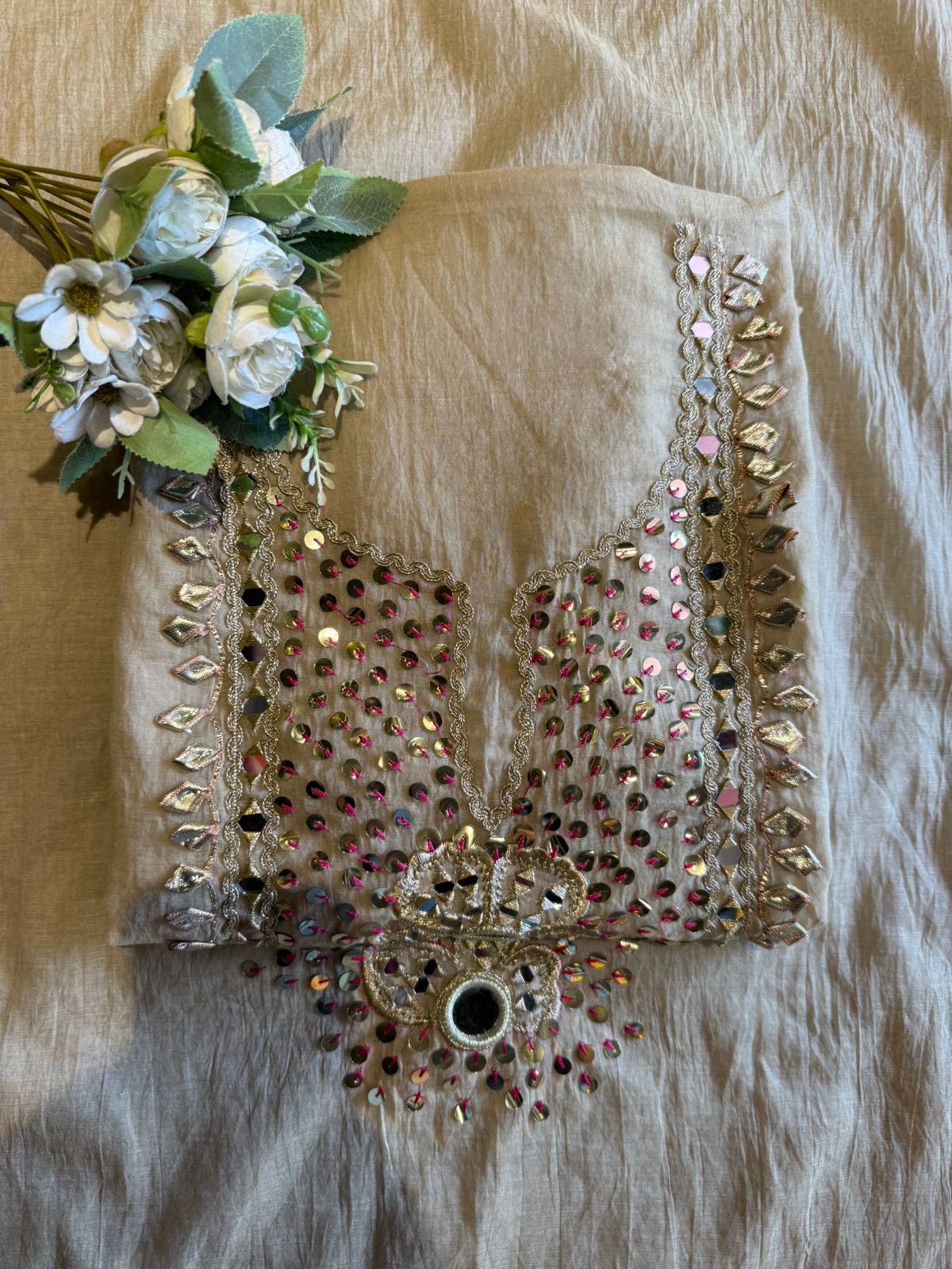 Heavily embellished traditional suit