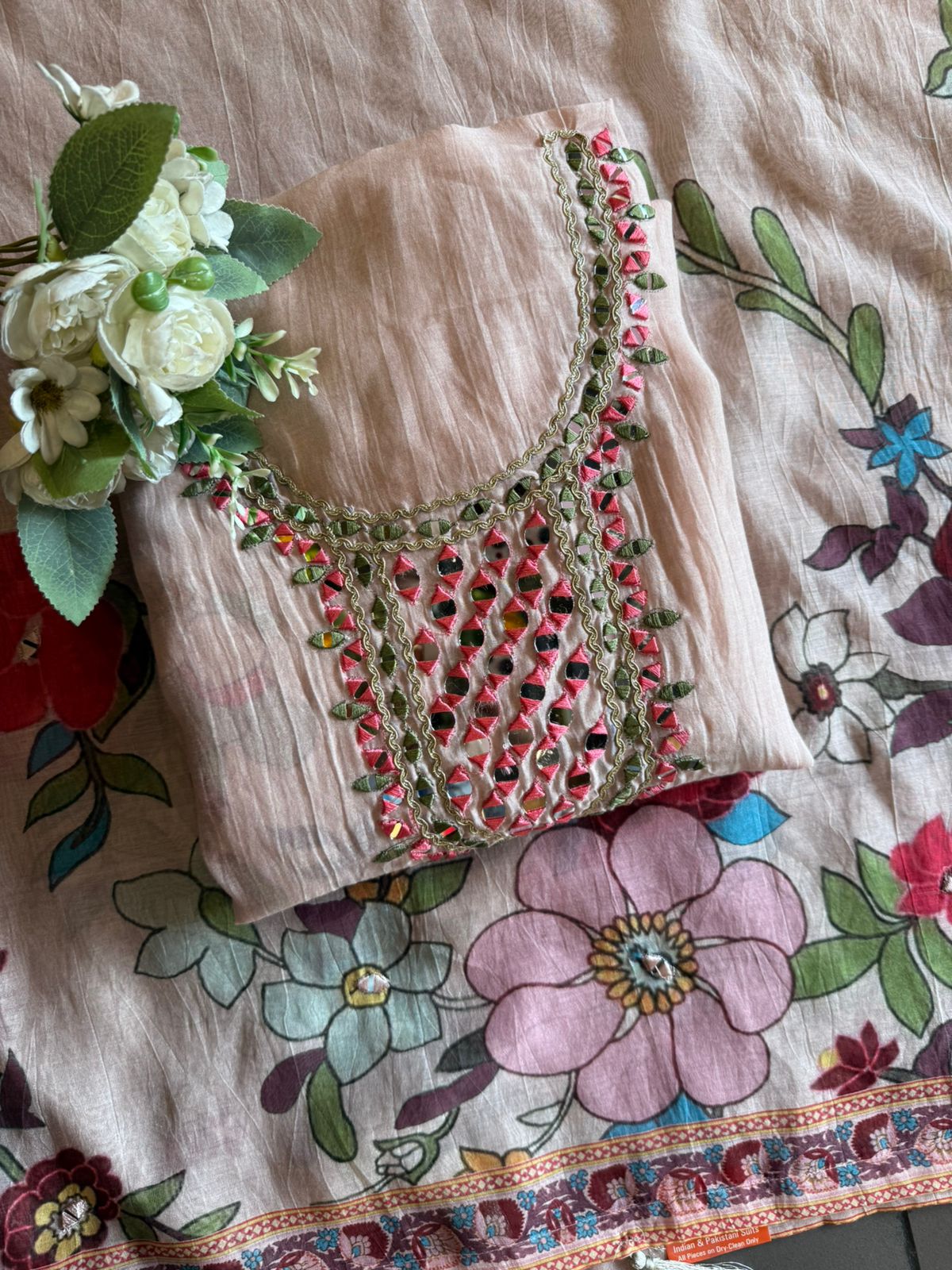 Graceful suit set On Mul cotton adorned with vibrant floral print