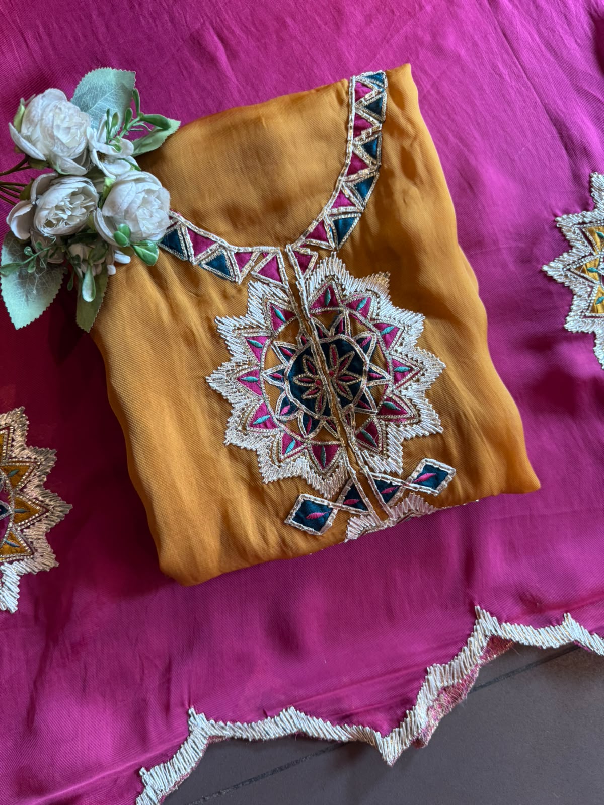 Multicoloured thread embroidery unstitched suit